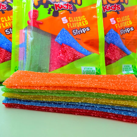 Sour Patch Kids Strips - 3.5oz Strips In front of bags