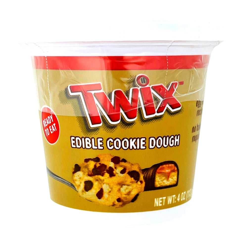 Twix Spoonable Cookie Dough 4oz Front, Twix Spoonable Cookie Dough, Spoonful of indulgence, Buttery cookie dough delight, Twix chocolatey-caramel magic, Nostalgic taste experience, Sweet tooth satisfaction, Cookie dough euphoria, Dessert topping, Luscious melt-in-your-mouth goodness, Spoonfuls of happiness, twix, twix candy, twix chocolate, twix cookie dough